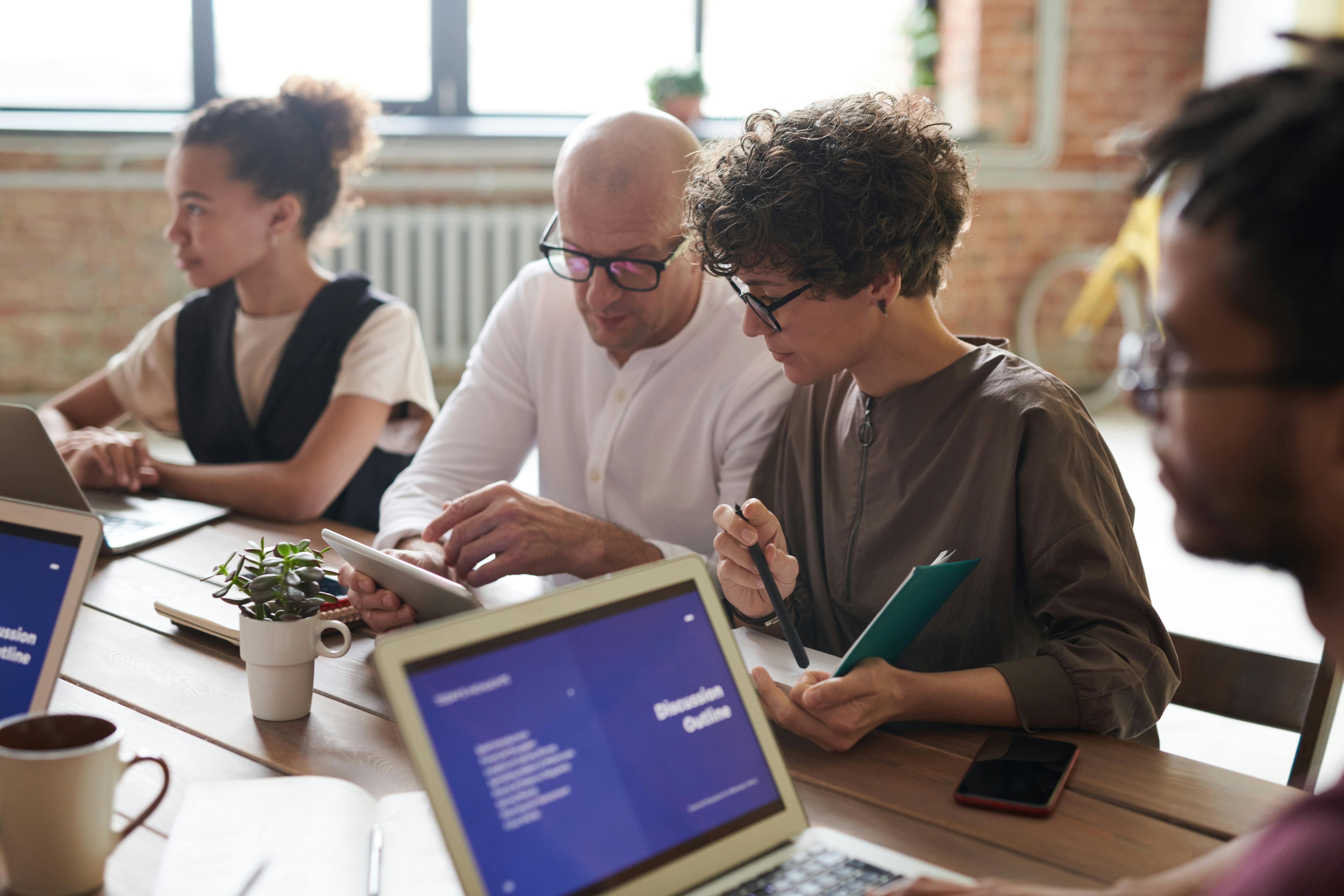 Group of people with laptops